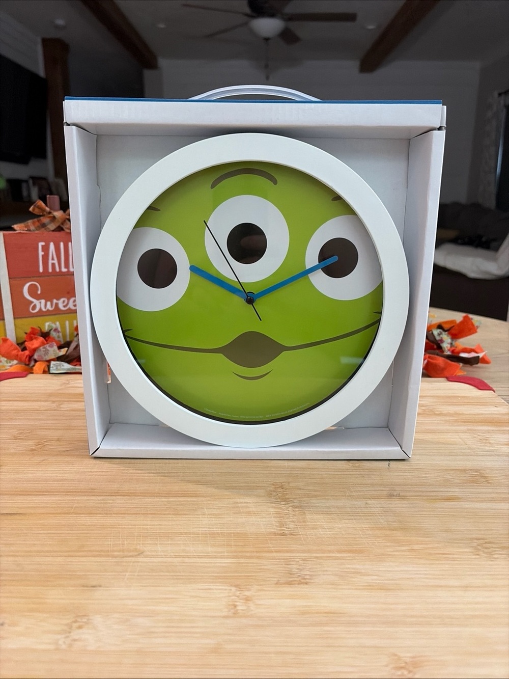 Disney Green Three-Eyed Alien Wall Clock with White Frame and Blue Hands